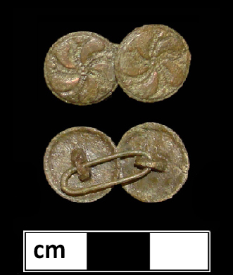Cast copper alloy buttons with a floral or pinwheel pattern on the front.